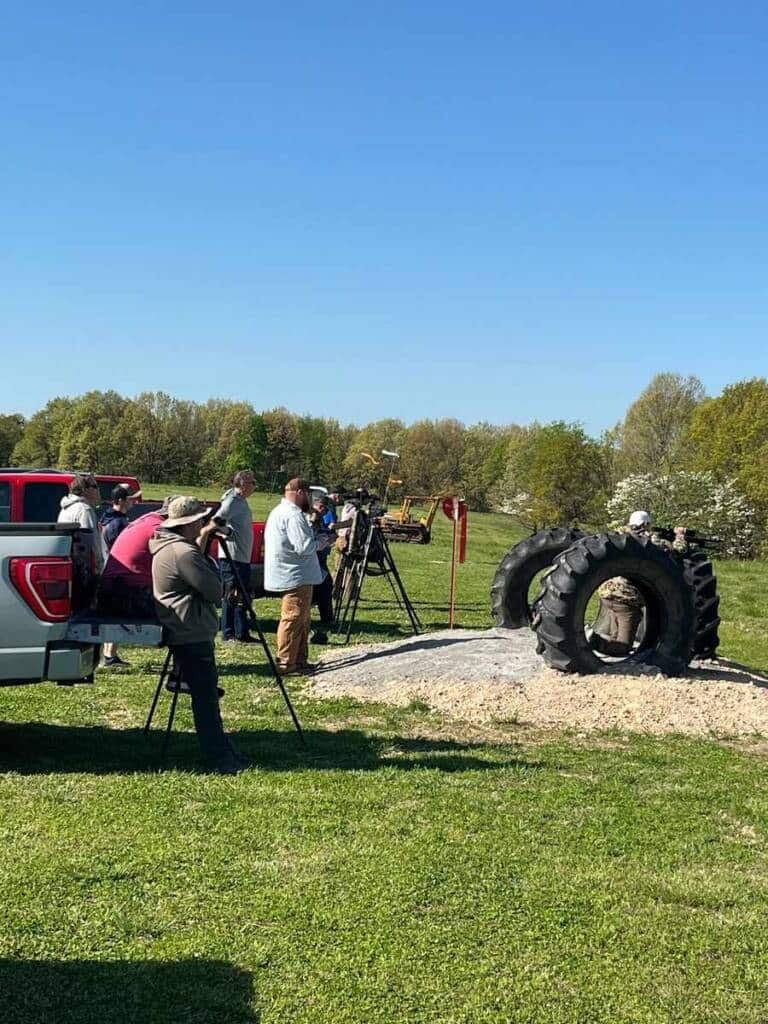 Group of participants observing a precision rifle shooting session at Recon By Fire in Oklahoma
